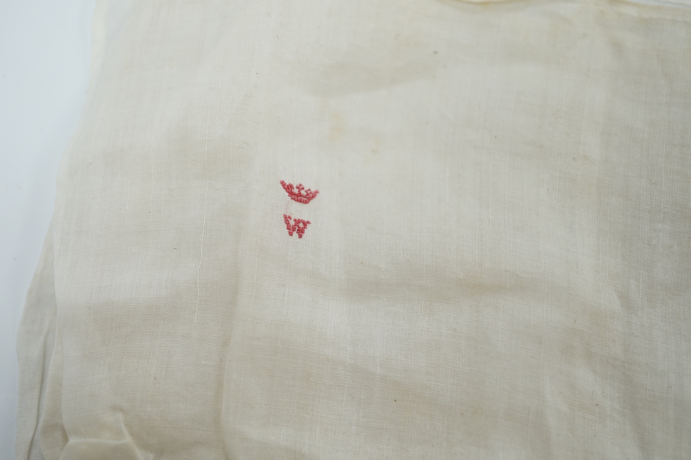 Two handkerchiefs, each bearing an embroidered ‘W’ below a coronet, understood without guarantee to relate to The Duke of Wellington, 36 x 34cm. Condition - fair, some staining and foxing